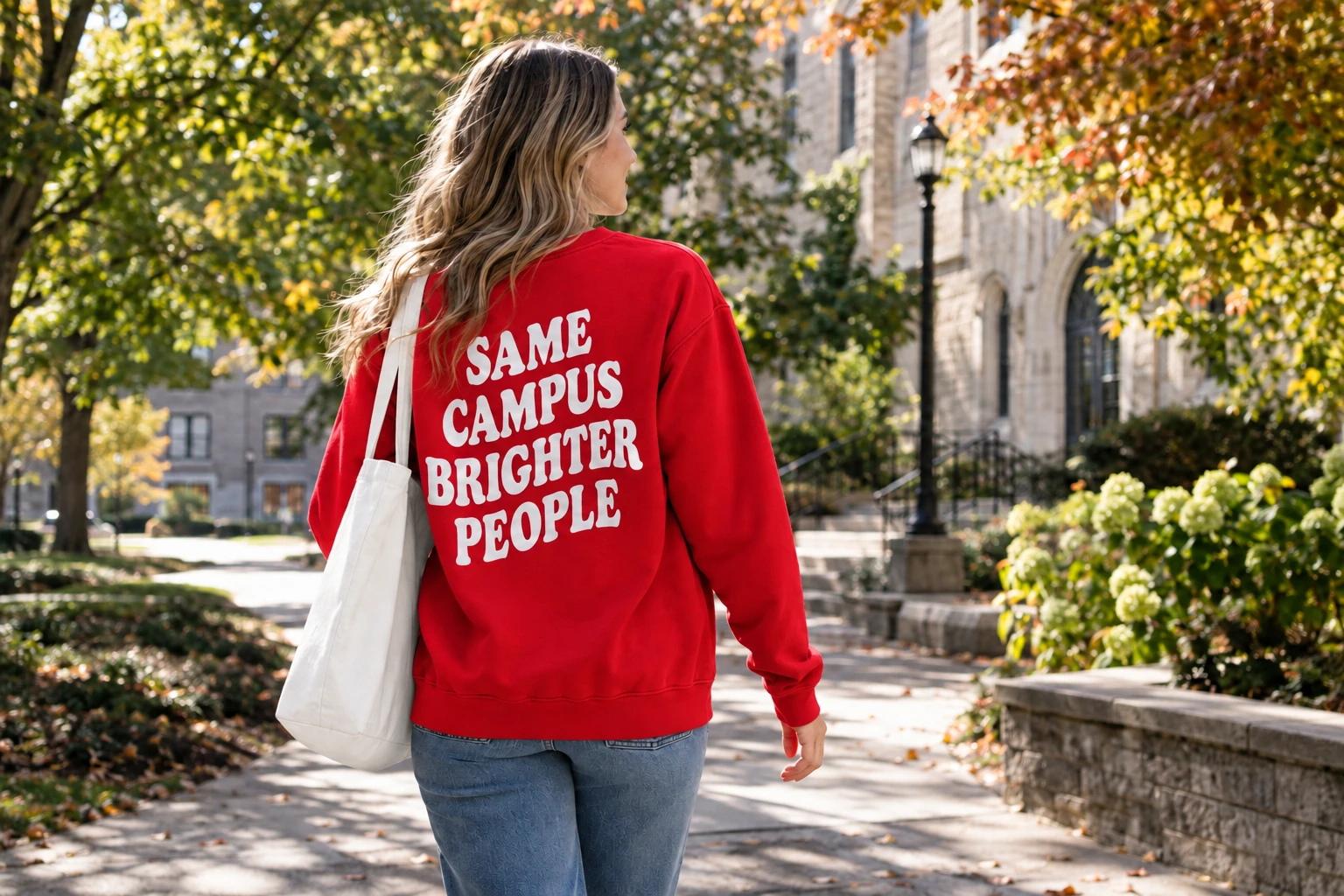 Student wearing a royal blue campus sweatshirt