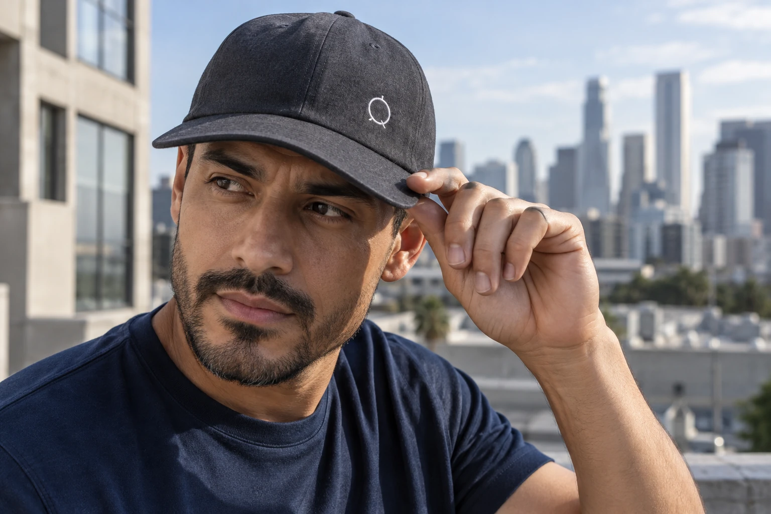 Man adjusting a charcoal cap