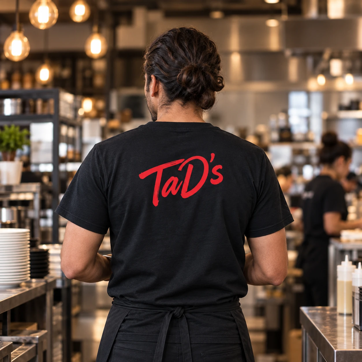 Illustrative kitchen team in branded uniforms