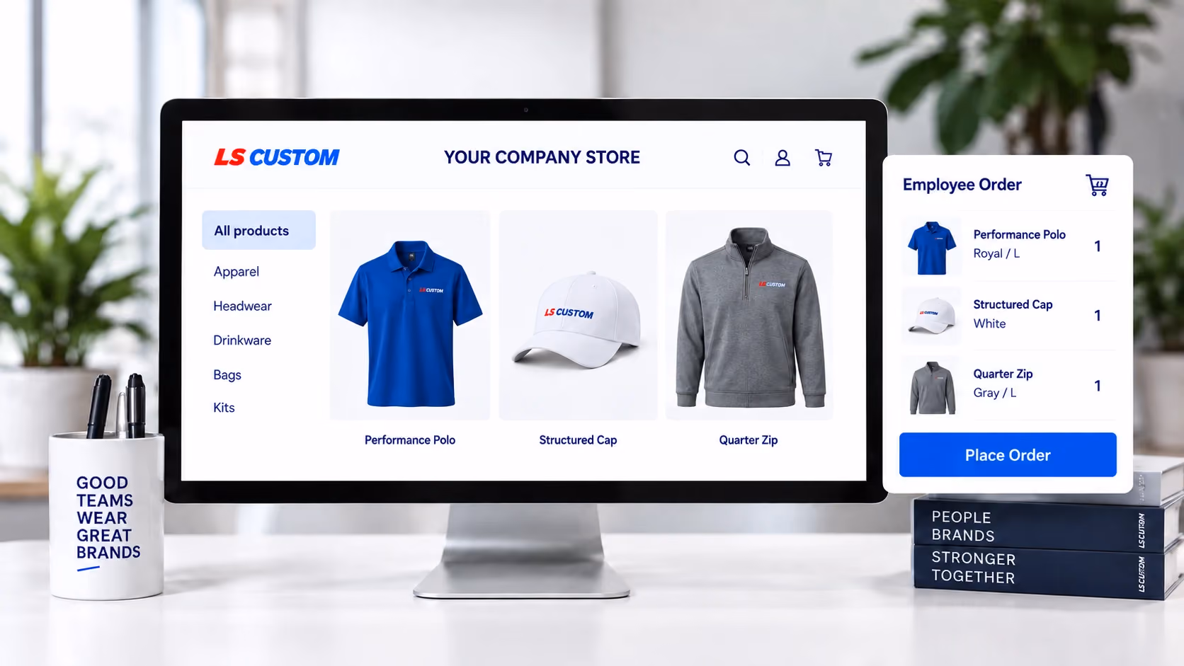 Company store concept showing a royal blue polo, white cap and gray quarter zip