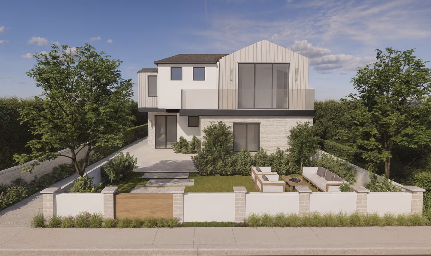 Modern two-story house with white and beige exterior, large windows, a front yard with outdoor seating, and trees on either side.