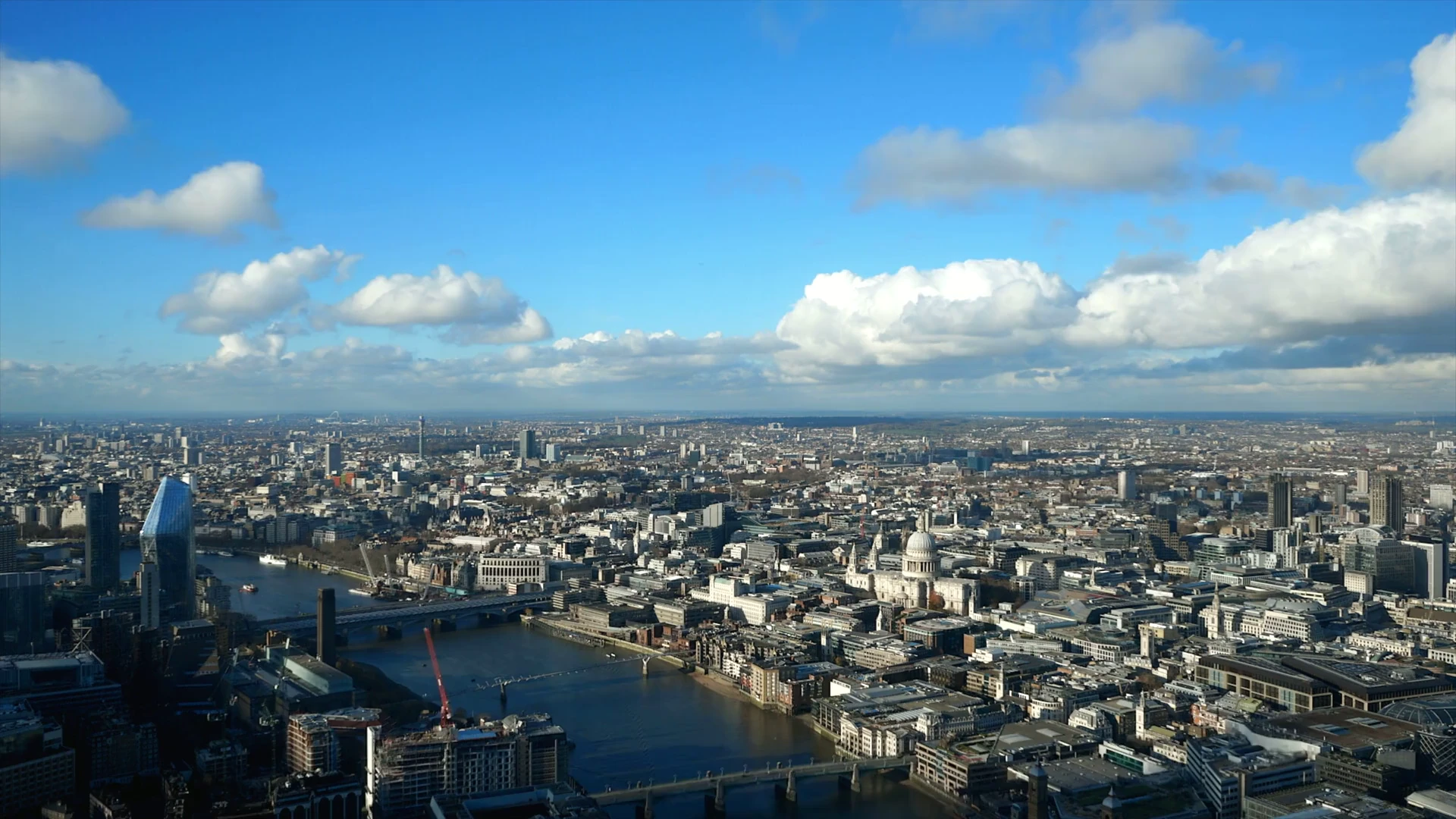A sunlit panorama across Central London, with St Paul’s Cathedral and the River Thames