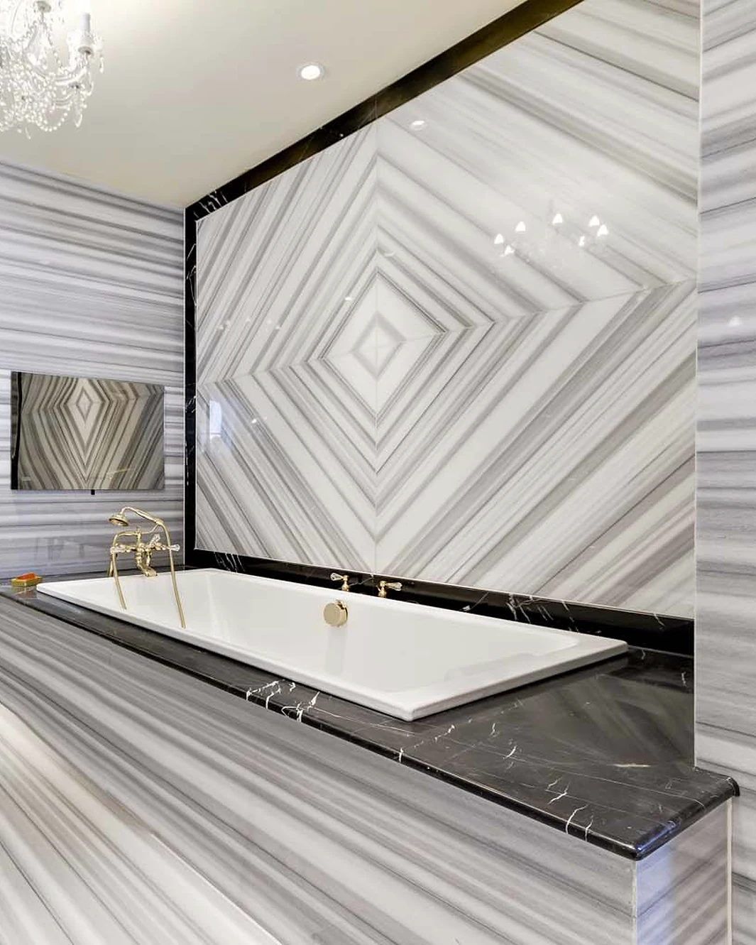 Banded stone walls and flooring around a bath and shower