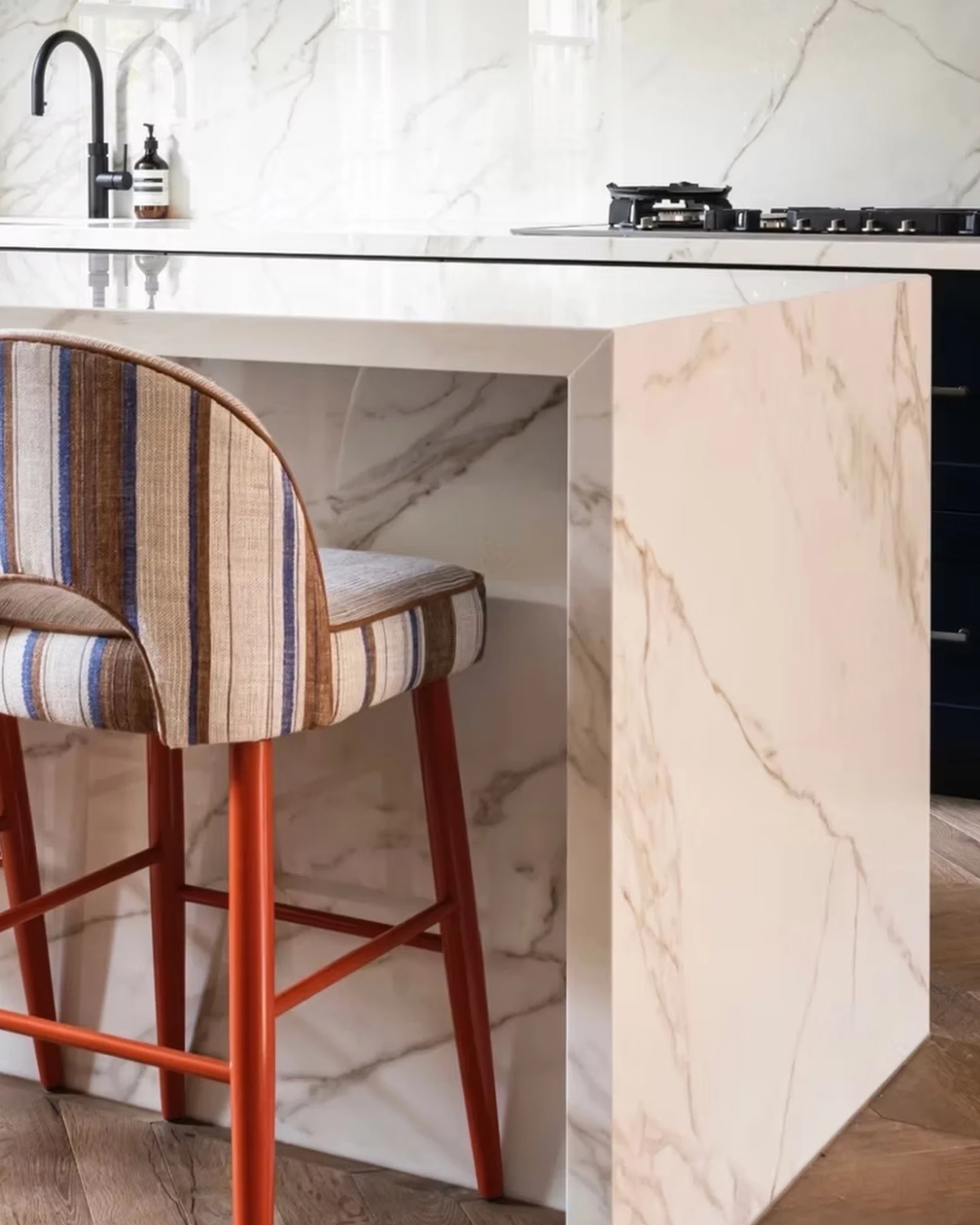 Porcelain kitchen island and fitted cabinetry at the Bourne Street residence