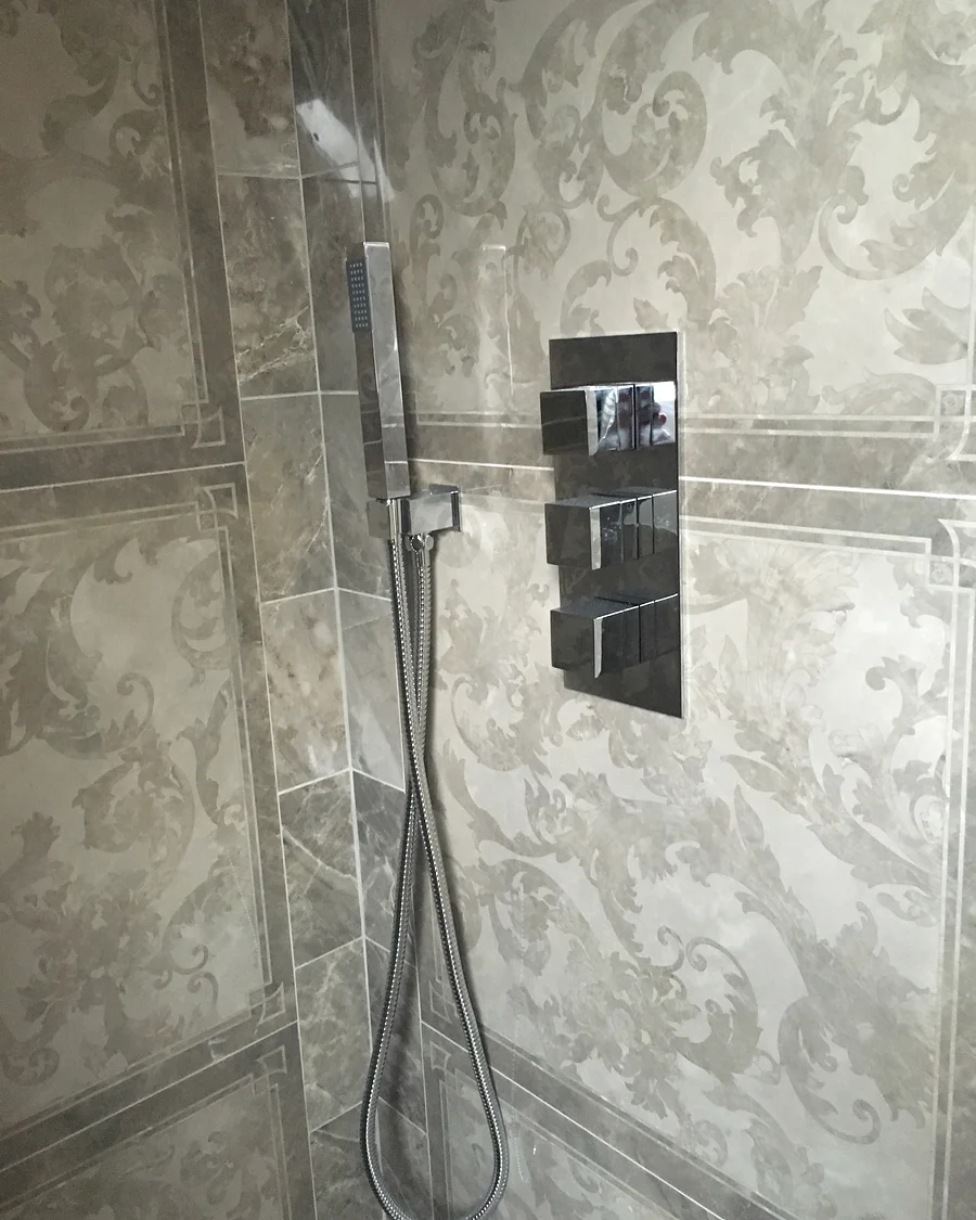 Regent’s Park Residence · Shower fittings set into stone — installation photographs