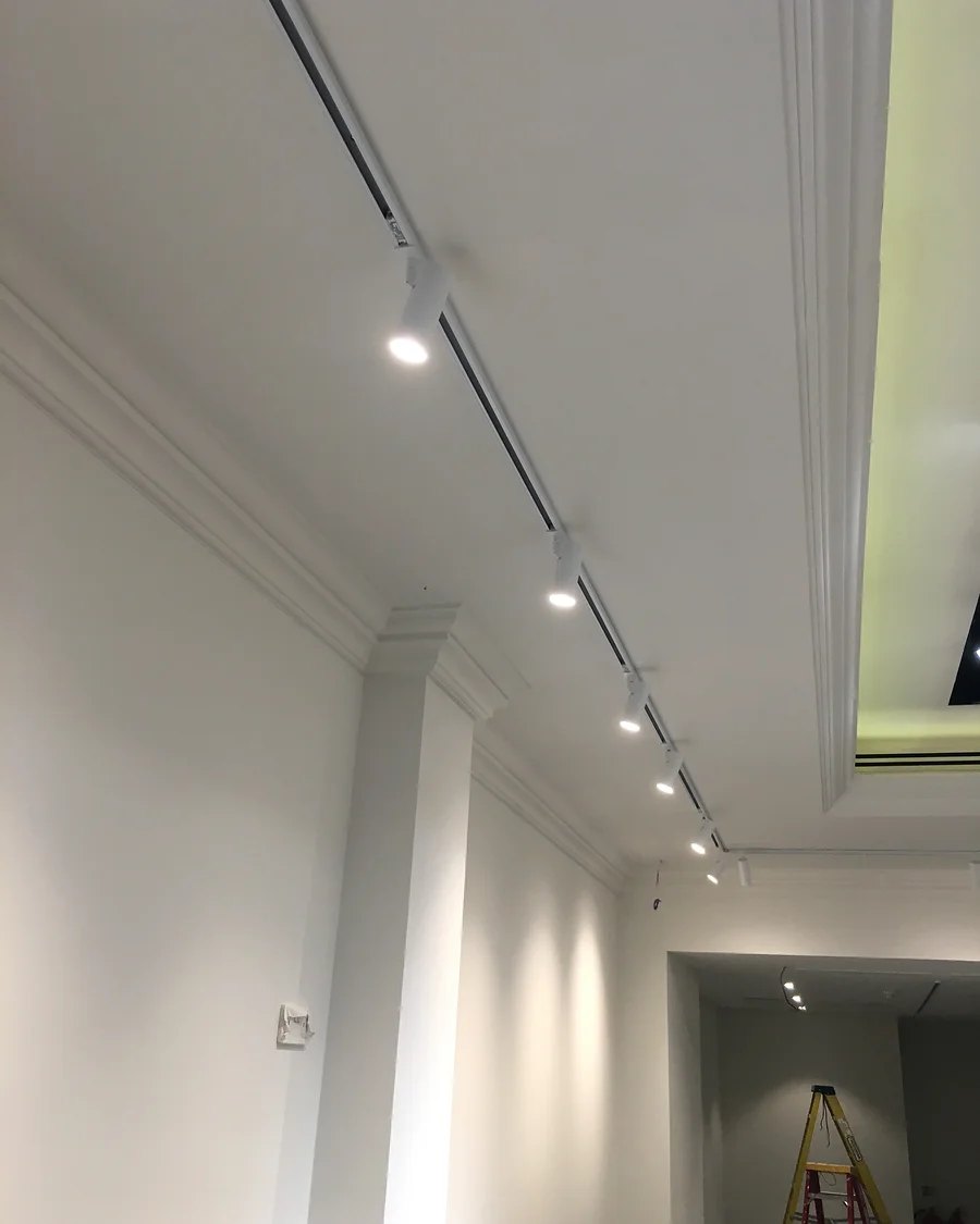 NU · King’s Road · Track lighting along the retail floor — installation photographs