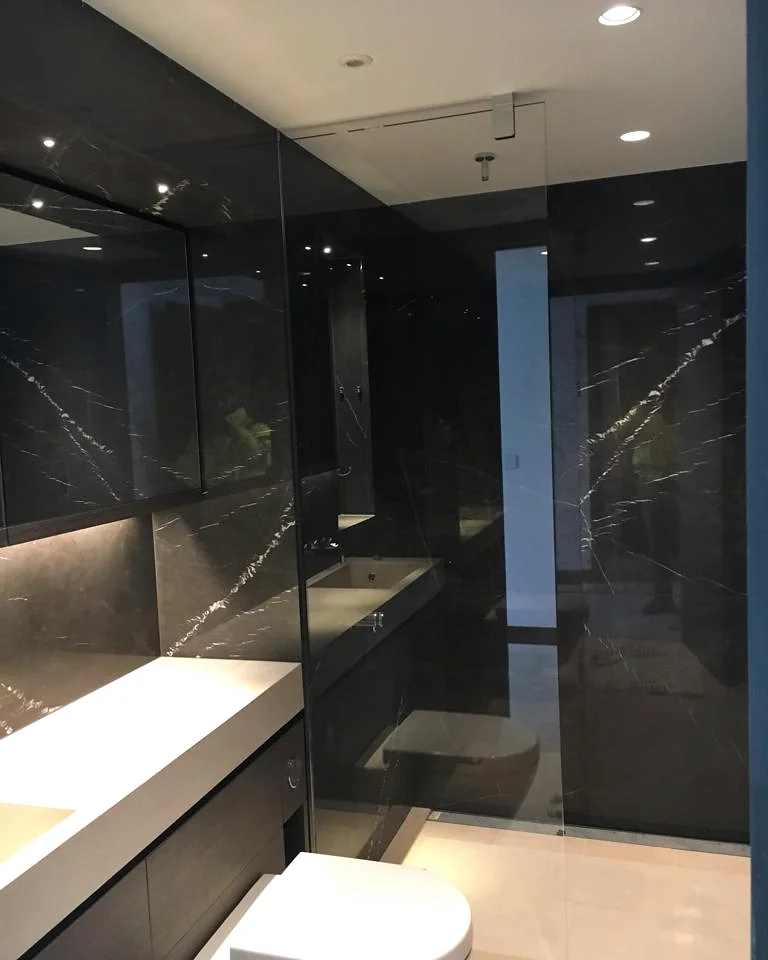 Blackfriars · Dark stone bathroom surfaces — installation photographs