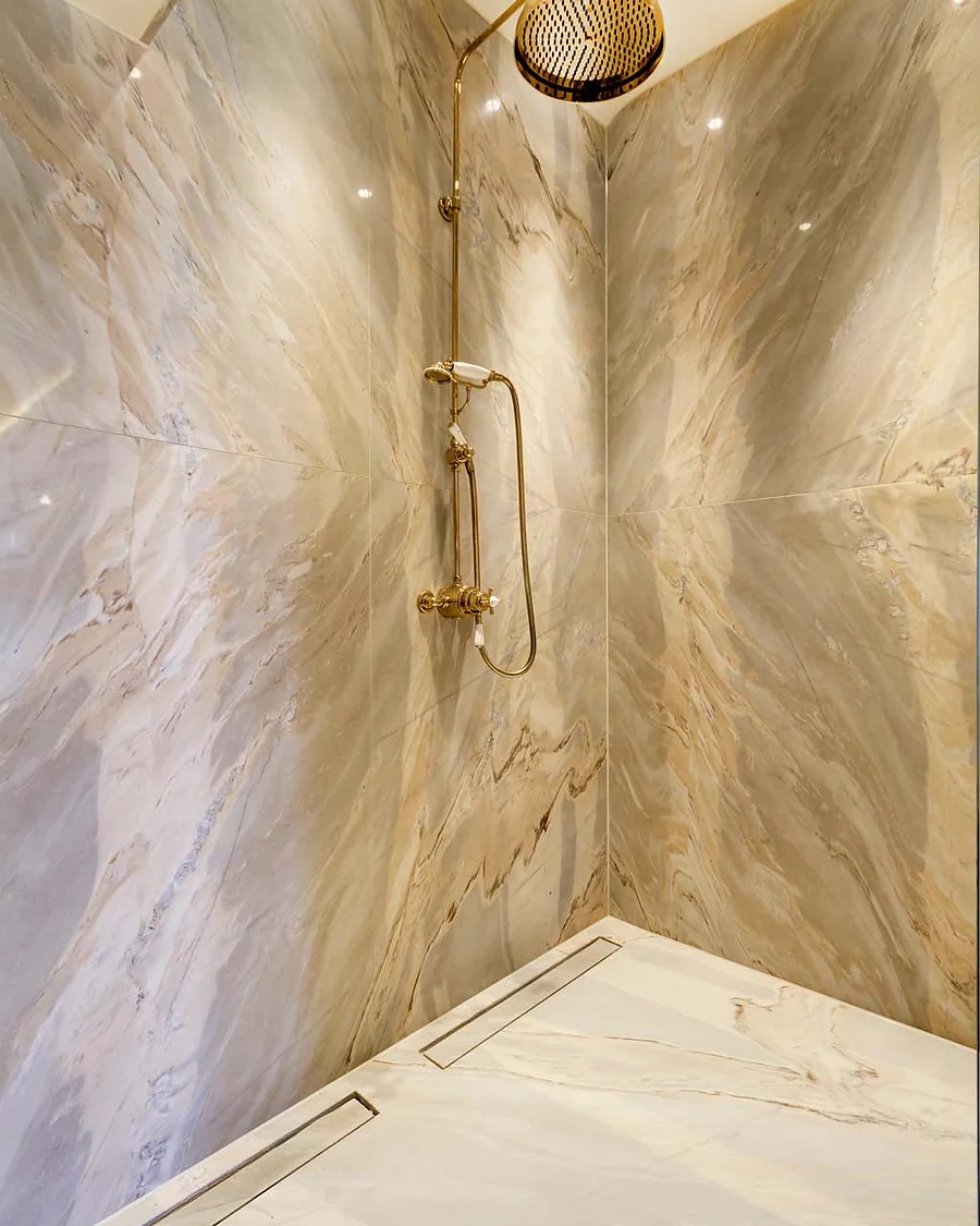 Marble & stone · Veined stone shower enclosure