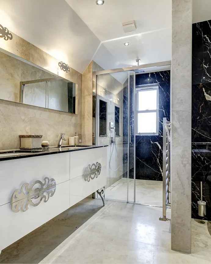 Marble & stone · Fitted vanity and contrasting stone surfaces