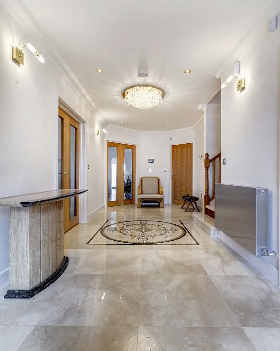 Marble & stone · Stone borders along a hallway floor