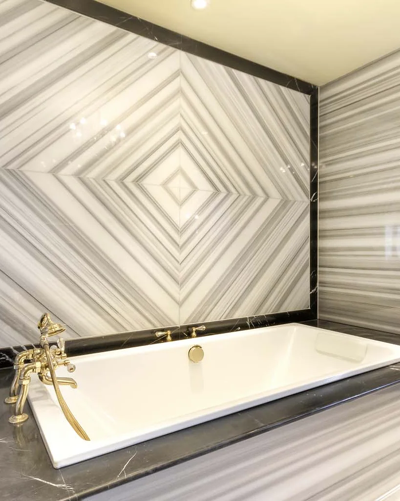 Marble & stone · Banded stone arranged around the bath