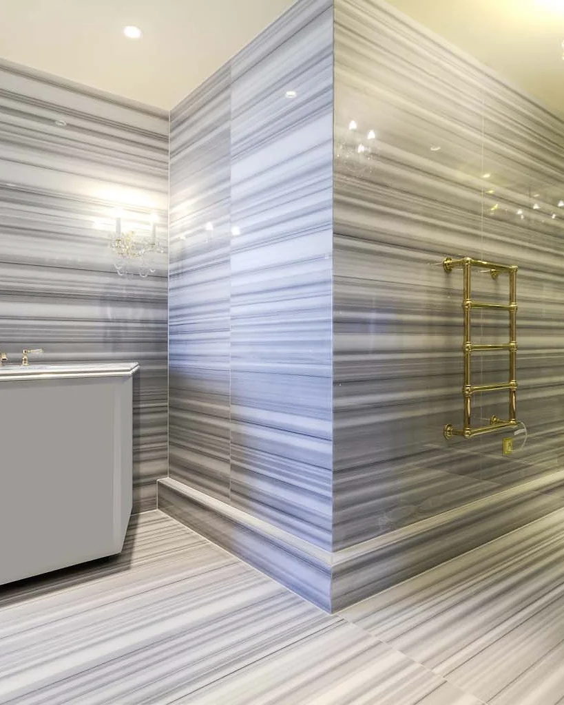 Marble & stone · Banded stone walls meeting the shower area
