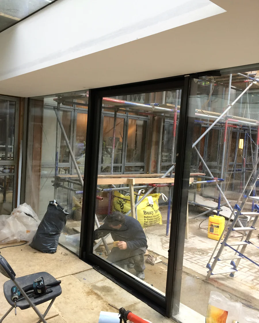 Glass details · Glazed doors during installation — installation photographs