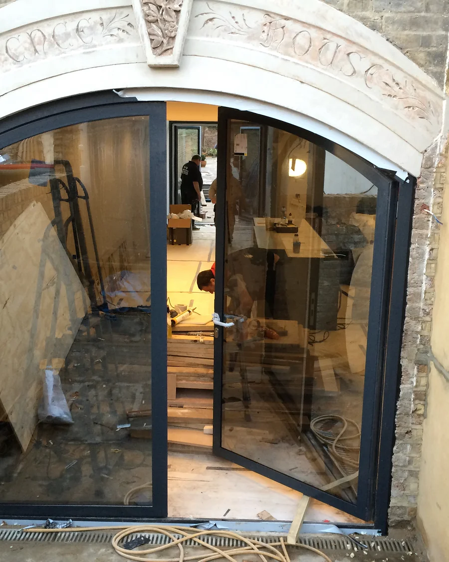 Glass details · Arched opening with fitted glazing — installation photographs