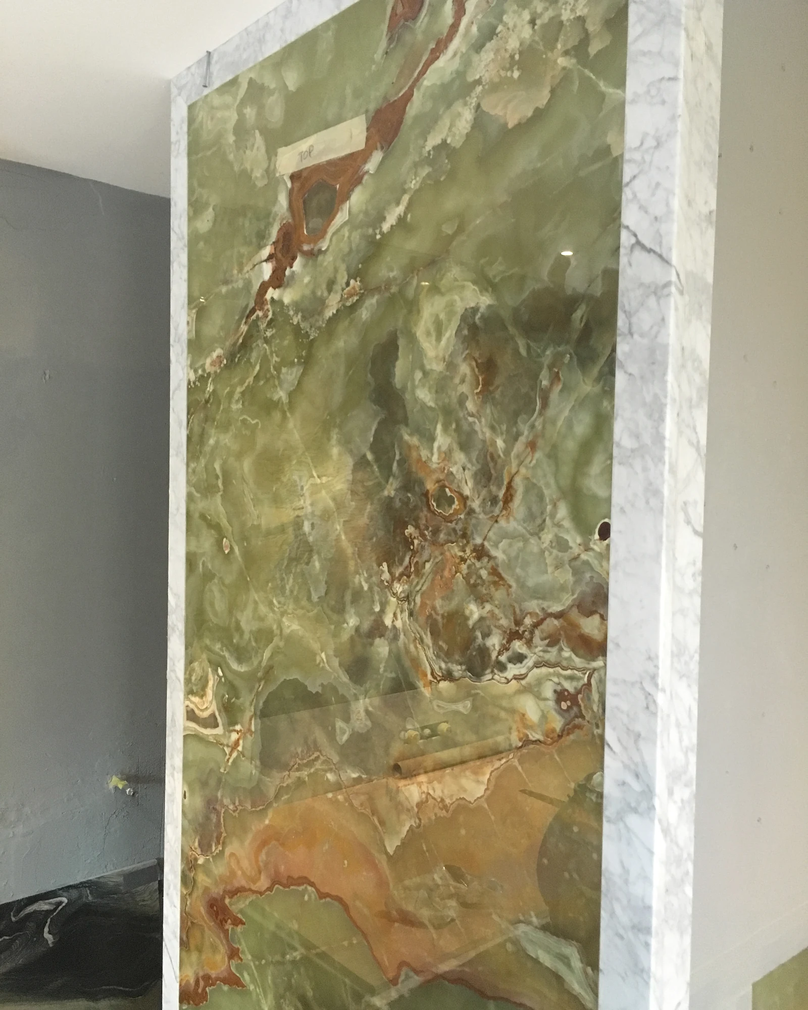 Green stone feature panel during installation