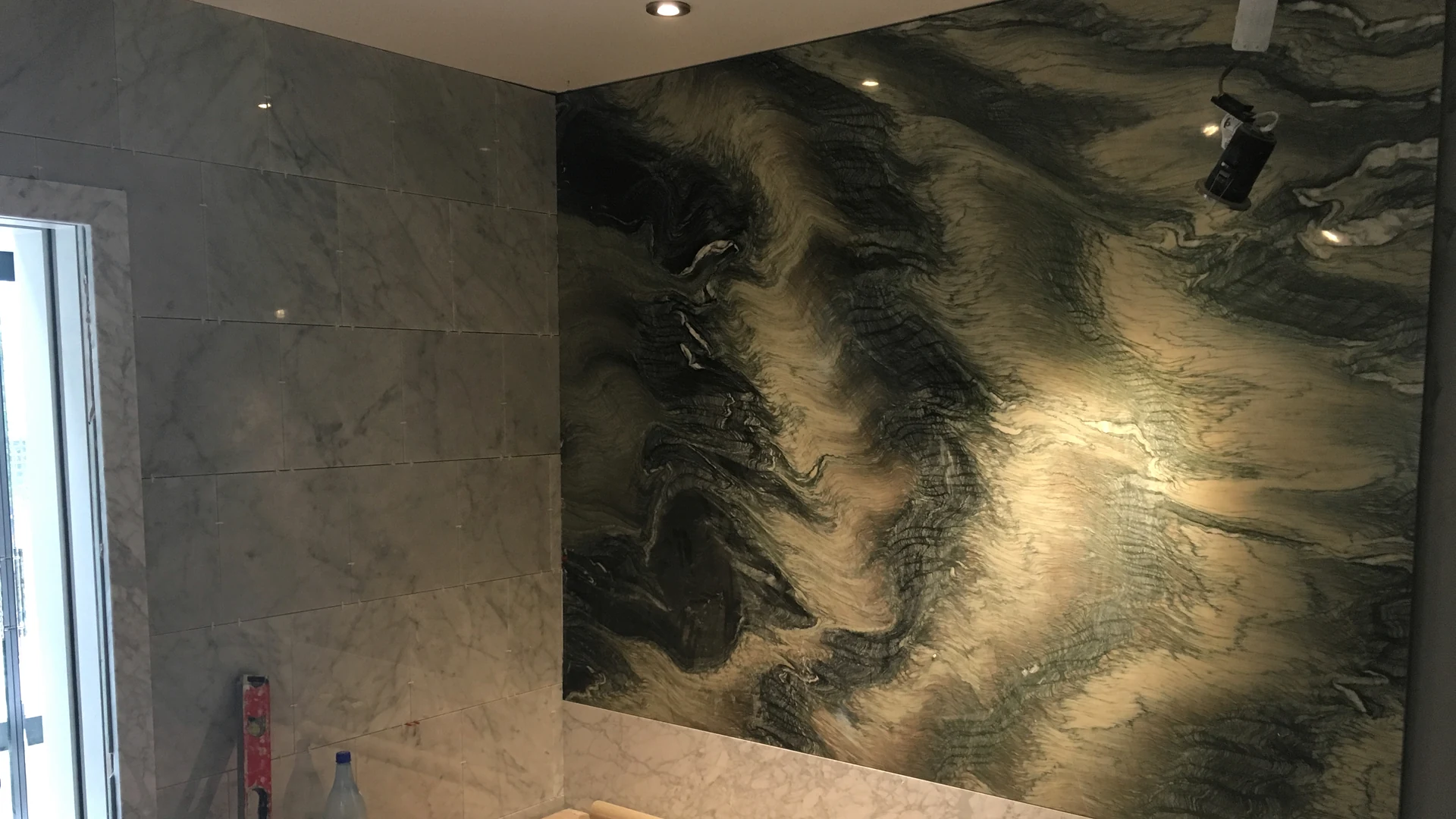 Stone feature wall and adjoining surfaces during installation at the Regent’s Park Residence