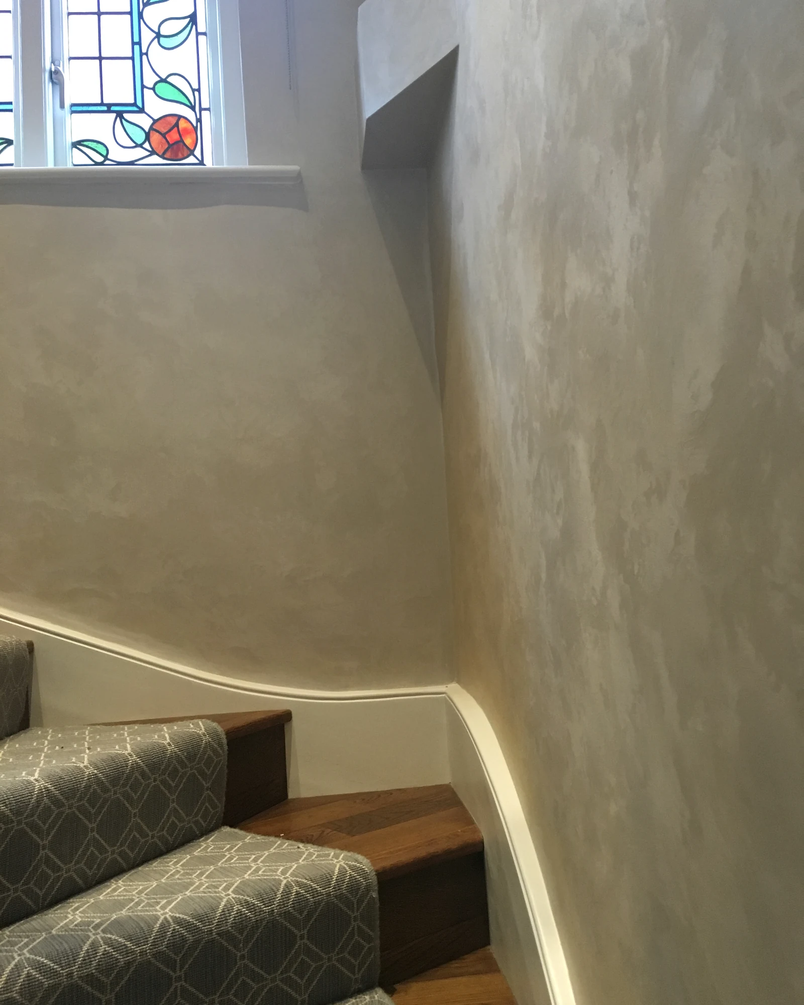 Textured wall finish beside the stair