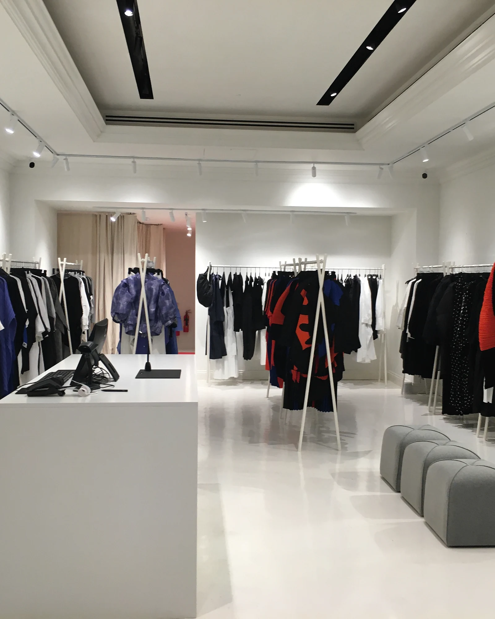 NU retail interior at King’s Road, with pale flooring, linear lighting and clothing displays