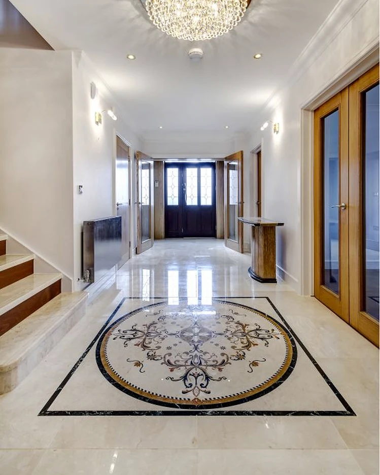Polished hallway floor with a decorative stone inlay