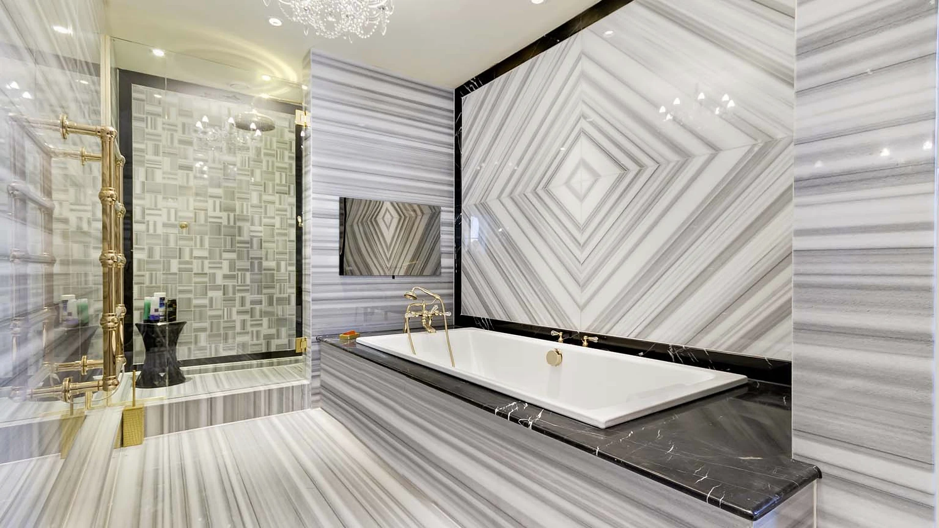 Banded stone walls and flooring around a bath and shower