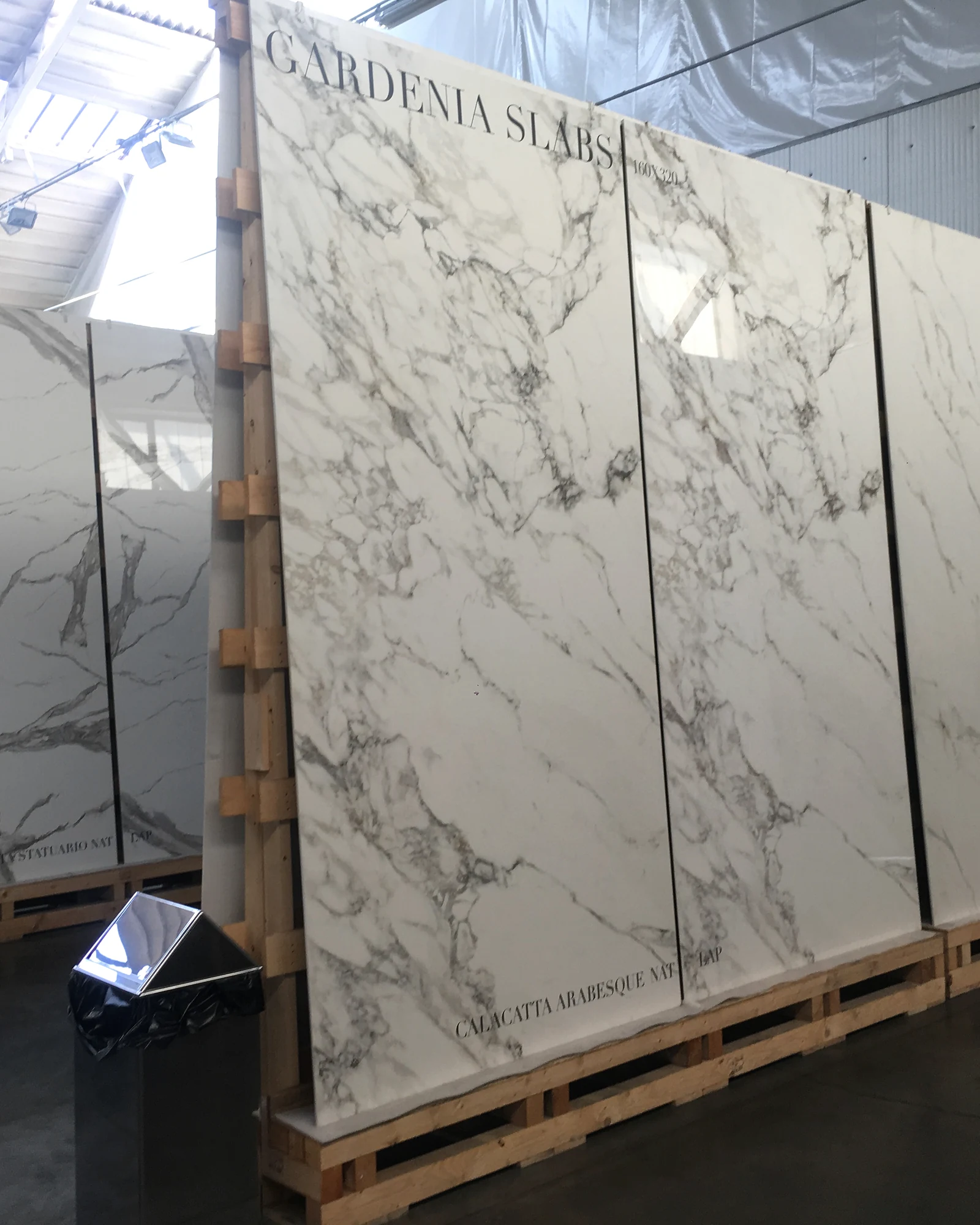 Large-format surface slabs photographed during an Italian supplier showroom visit
