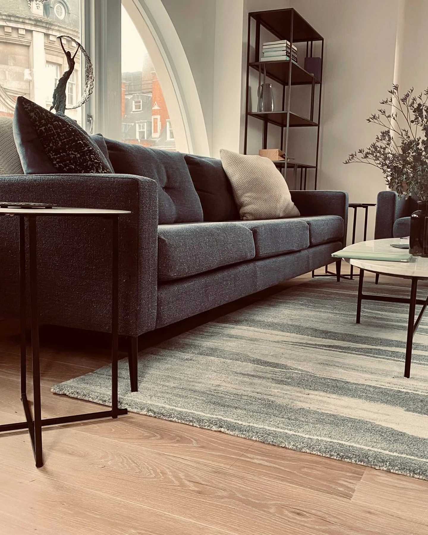Holborn living room with an arched window and timber flooring