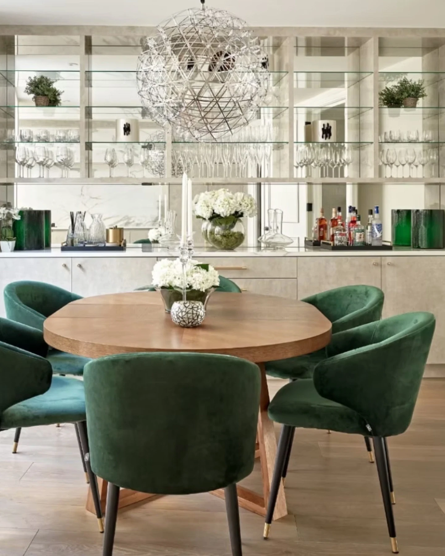 Upholstered dining chairs and mirrored joinery in the Knightsbridge residence