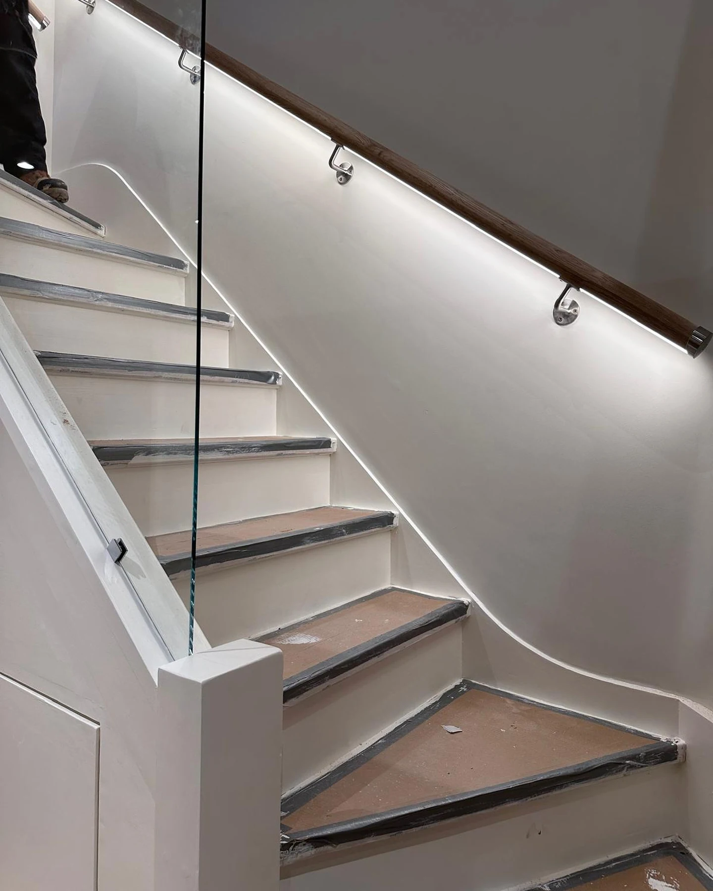 Bespoke staircase detailing with integrated lighting in the Holborn penthouse