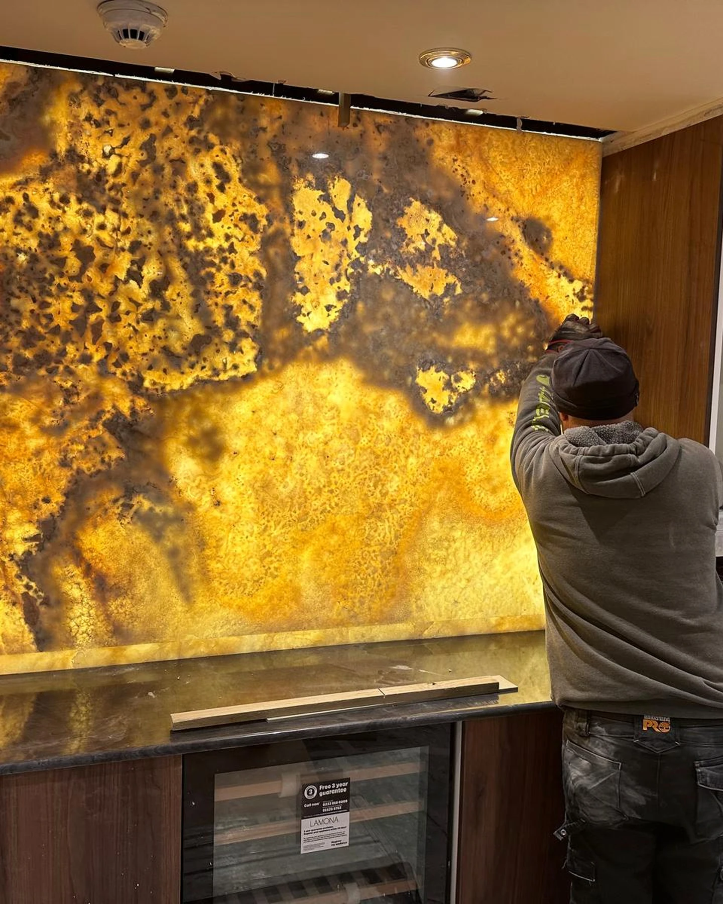 Installation of illuminated architectural onyx