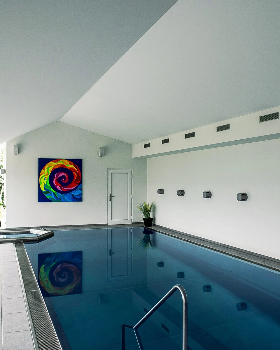 White DESCOR acoustic textile ceiling above a private pool in Basel, a PONGS manufacturer reference