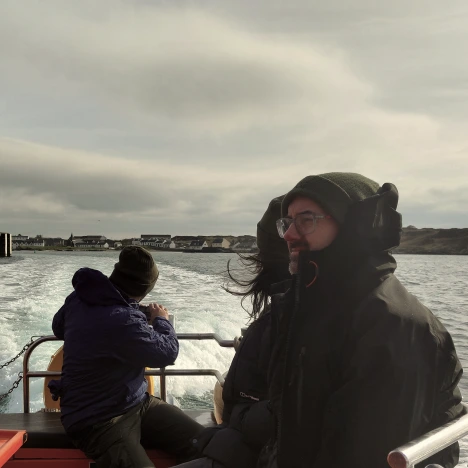 383 Group team members travelling by boat during a site visit for the Glenmorangie project.
