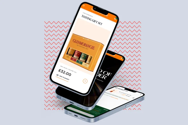 Three floating smartphones displaying different e-commerce product pages, including a Glenmorangie whisky tasting gift set priced at £32.00.