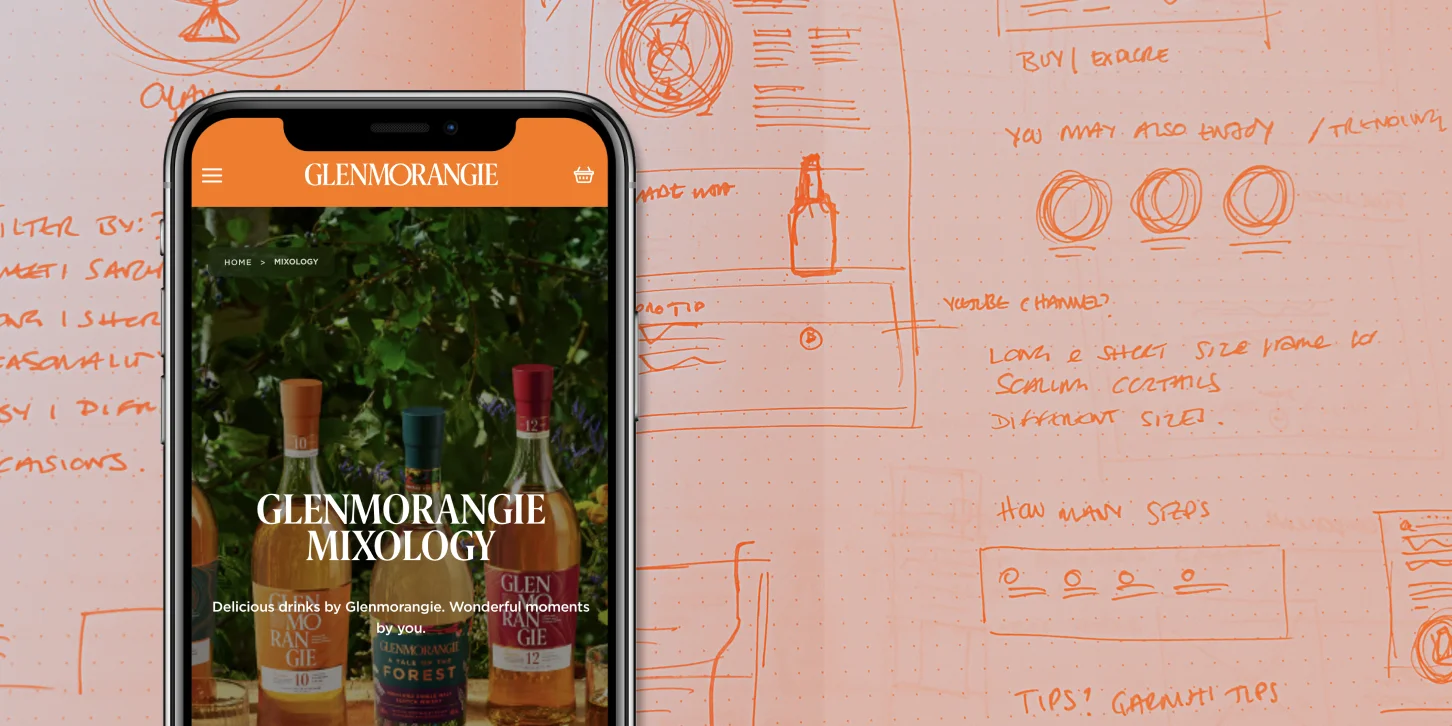 Smartphone screen displaying Glenmorangie Mixology webpage with three whiskey bottles and green foliage background.