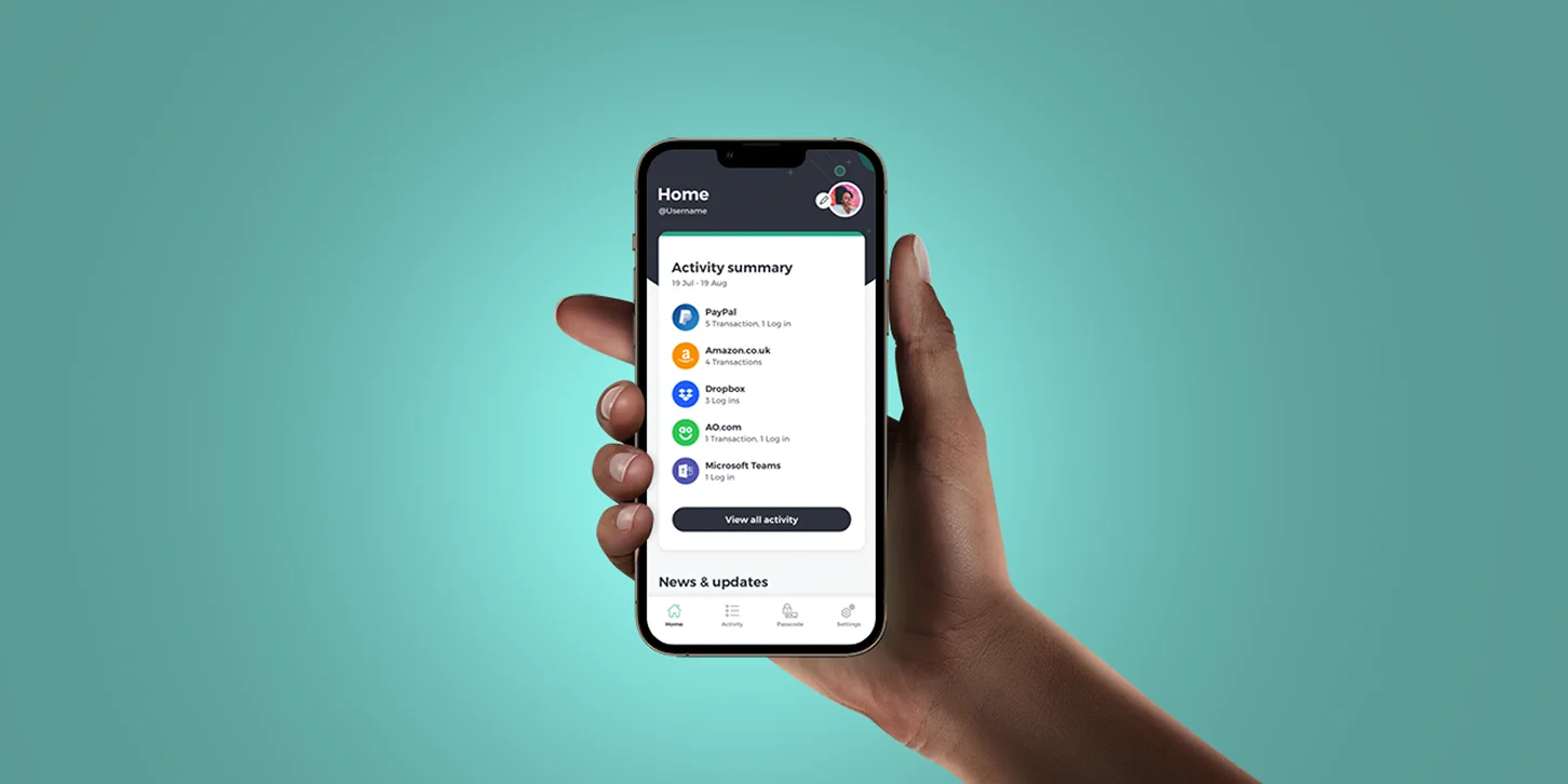 Hand holding a smartphone displaying a home screen with an activity summary of transactions and logins for apps like PayPal, Amazon, Dropbox, AO.com, and Microsoft Teams.