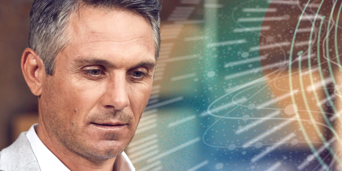 Middle-aged man with gray hair looking downward thoughtfully, with digital data and circular interface graphics overlay on the right.