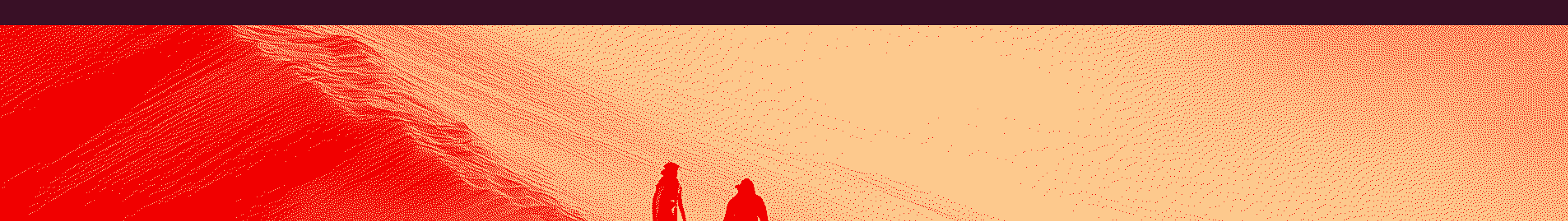 Two figures in red standing on a vast sandy desert with wind-swept dunes.