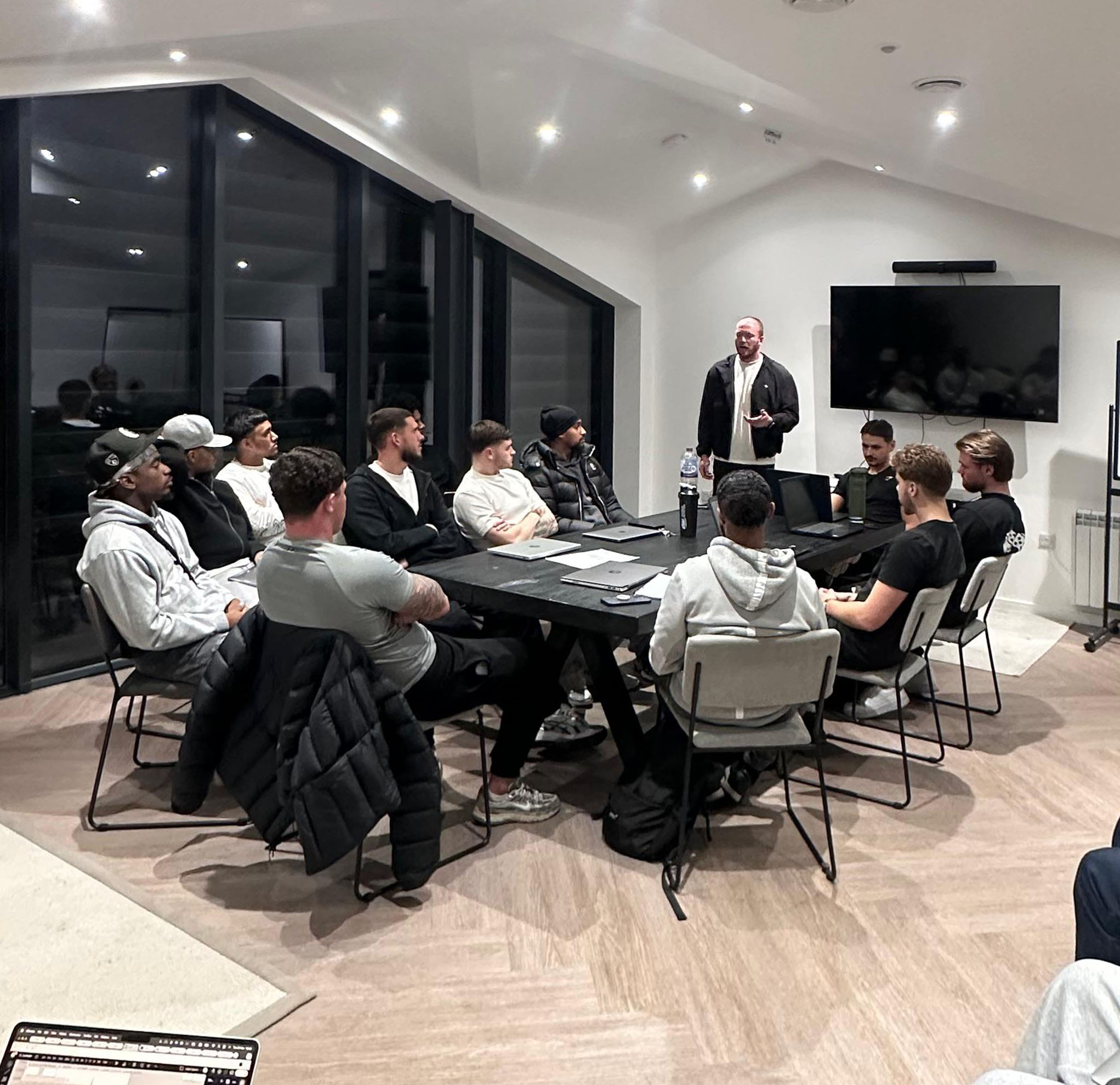 image of a diverse group of professionals in a meeting room for a digital marketing & advertising agency