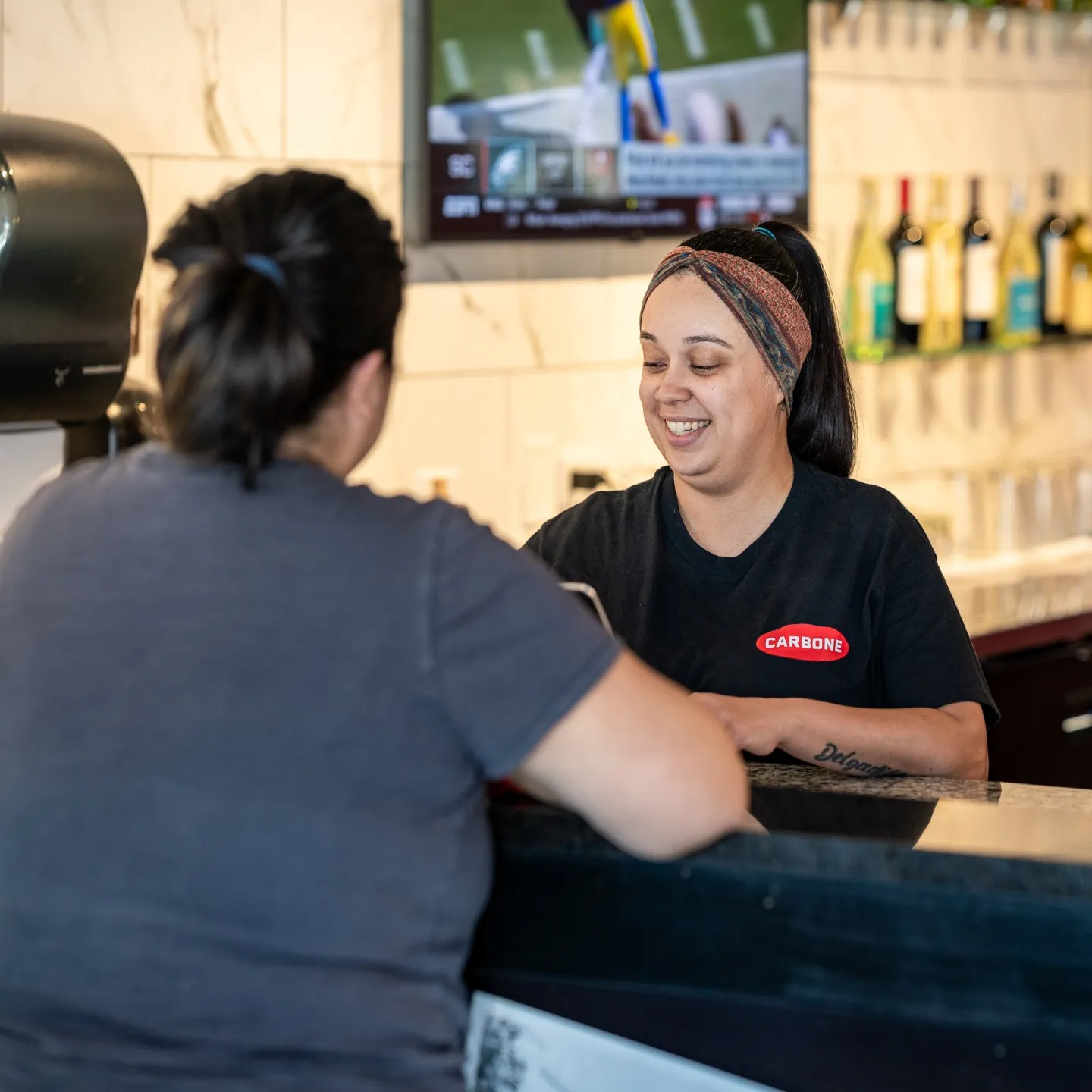a cashier with some clients