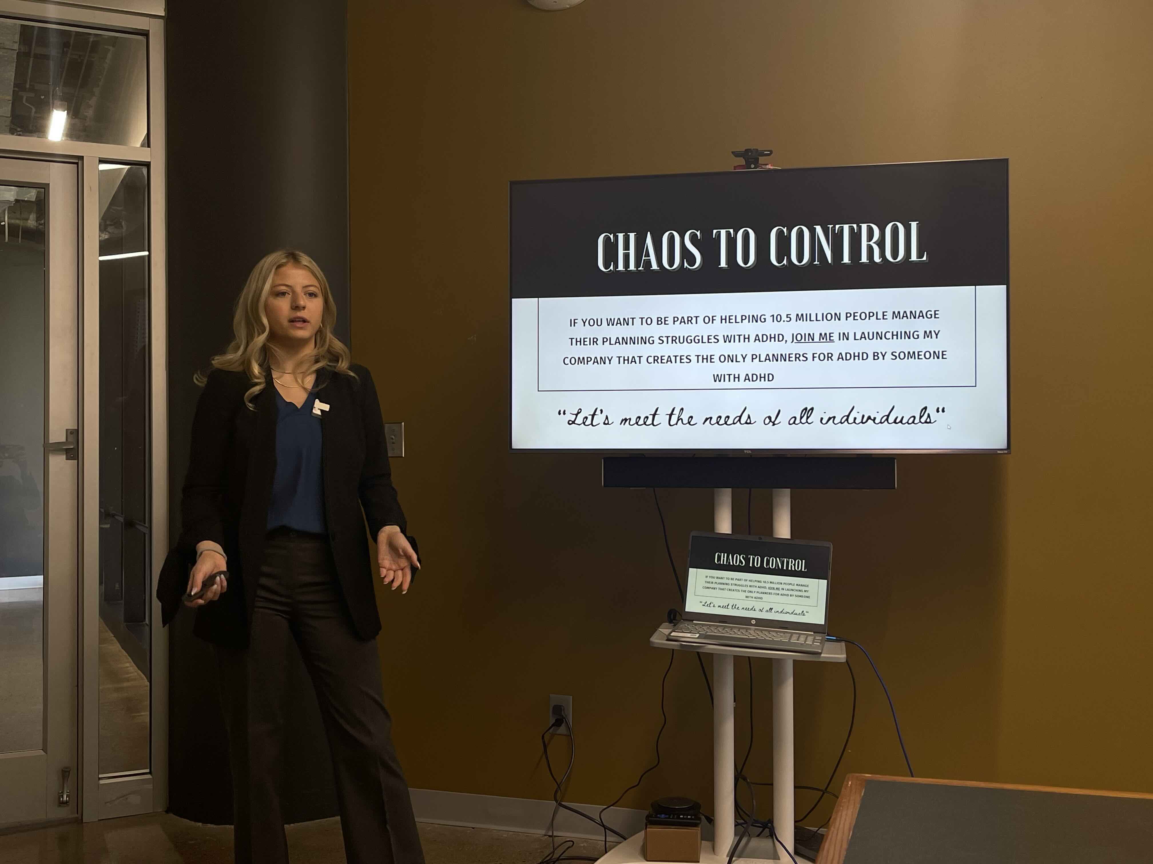 Young women pitching her business idea to judges.