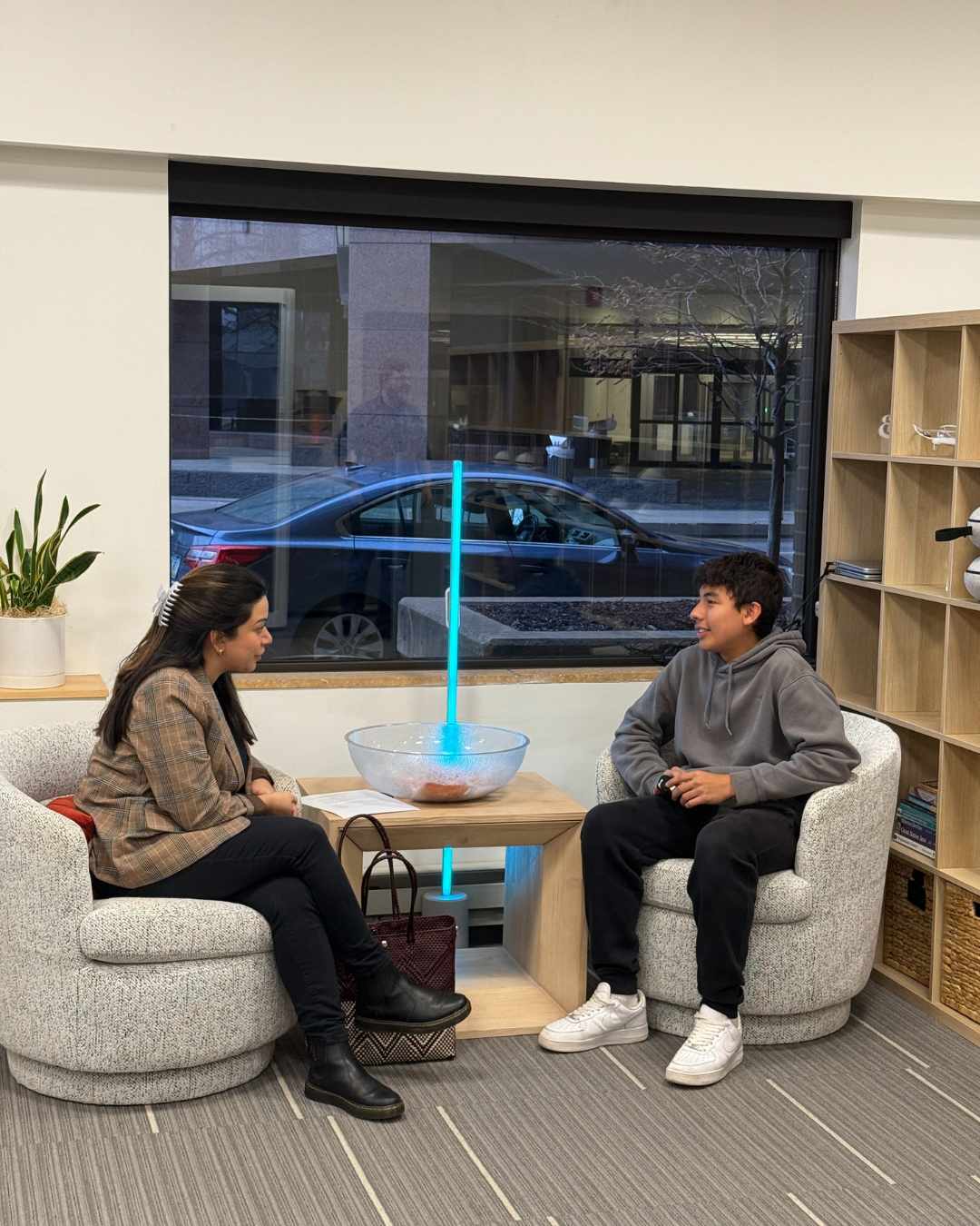 Student speaking to a professional to learn about different careers.