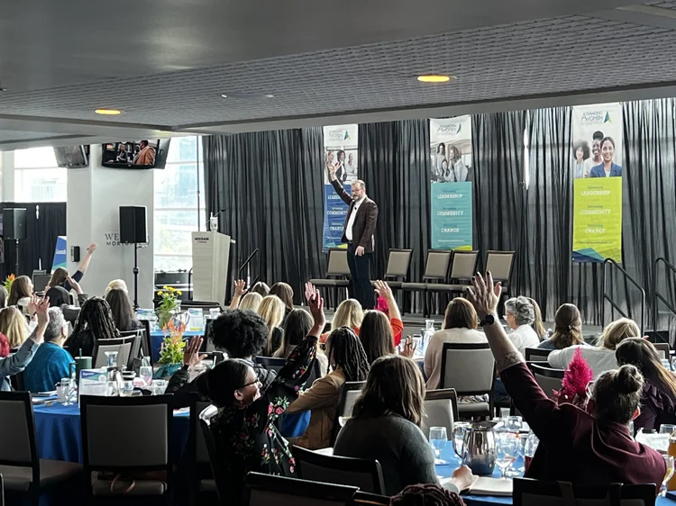 image of hands typing on a laptop with scientific data