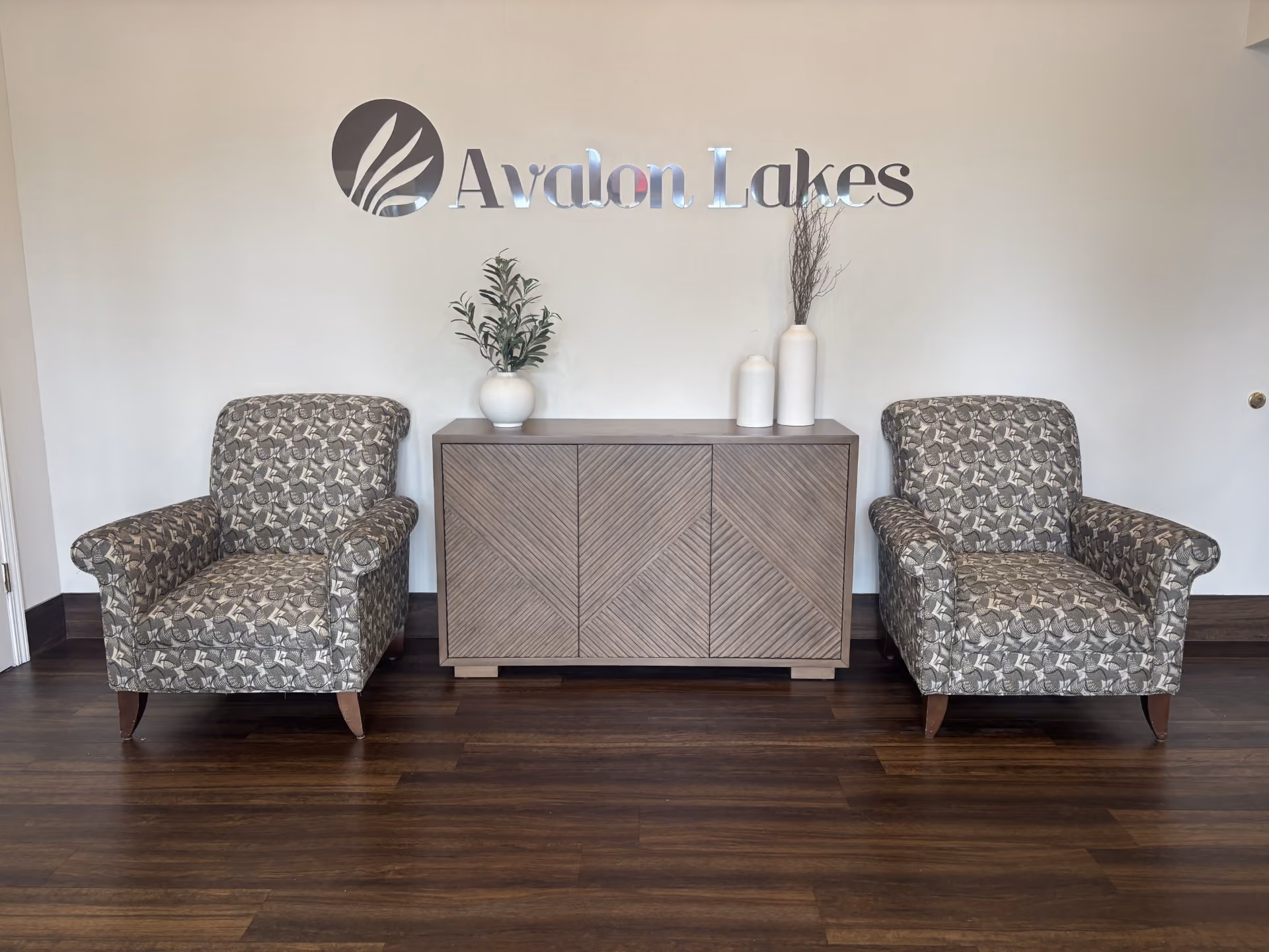 clubhouse lobby seating under Avalon Lakes signage