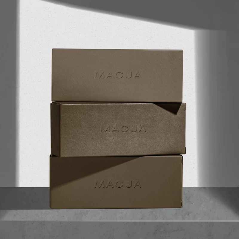 Stacked boxes with the Casa Macua logo