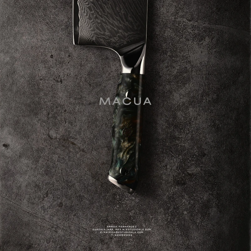 Close up of a knife with the Casa Macua logo and text