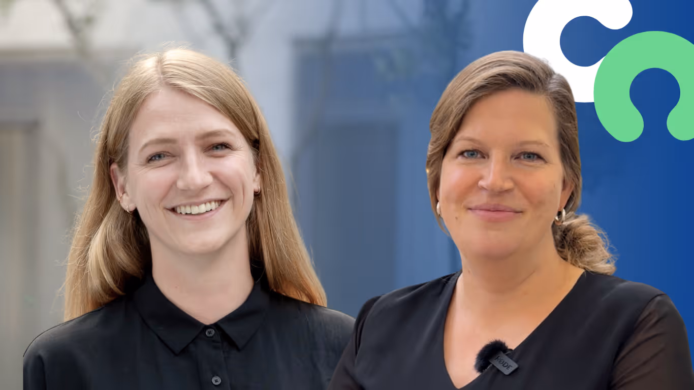 Nadia Argam and Jenny Stoffel from CoachMatcher against a blurred indoor background and CoachMatcher logo in the background