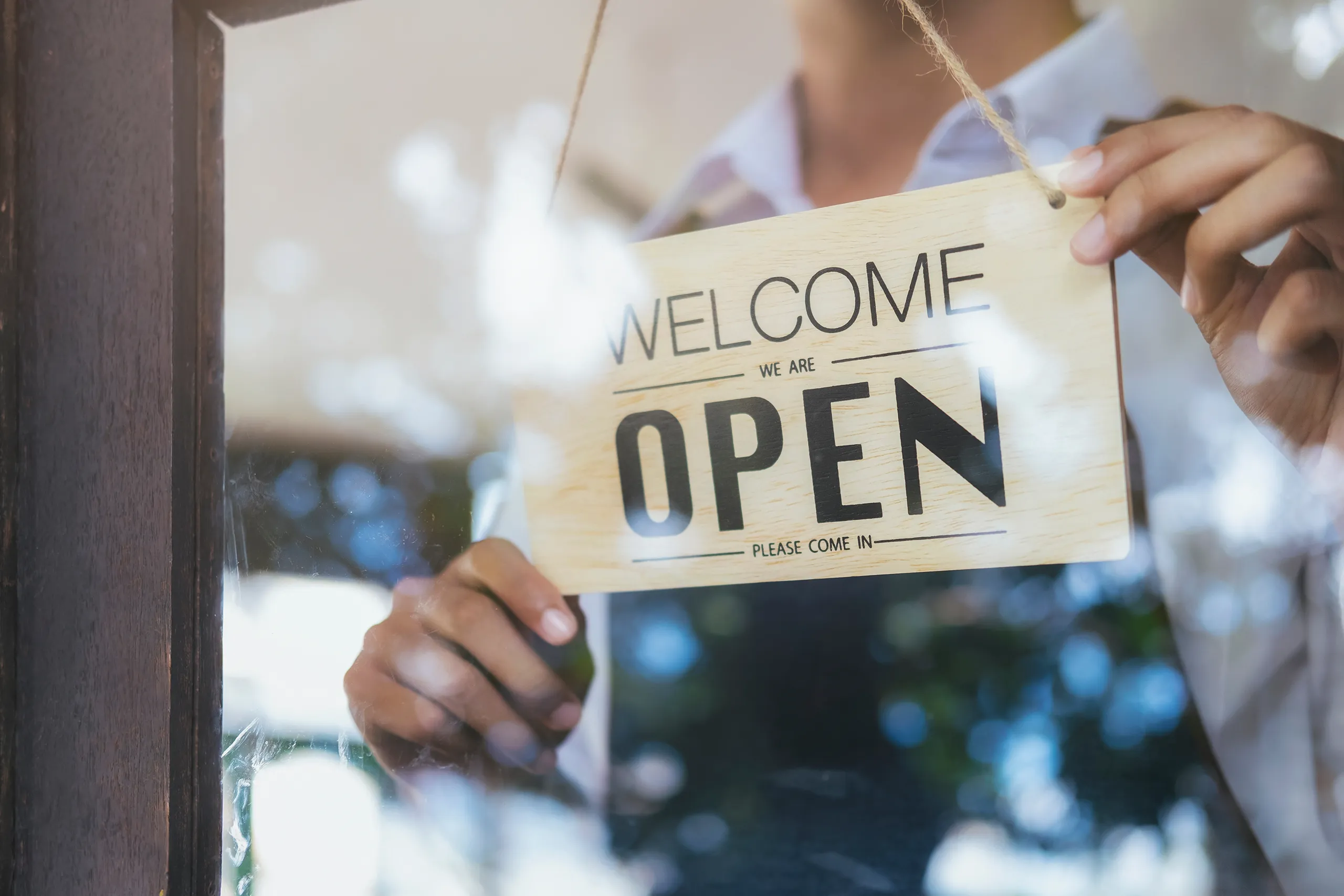 Small business owner reviewing documents representing business insurance coverage