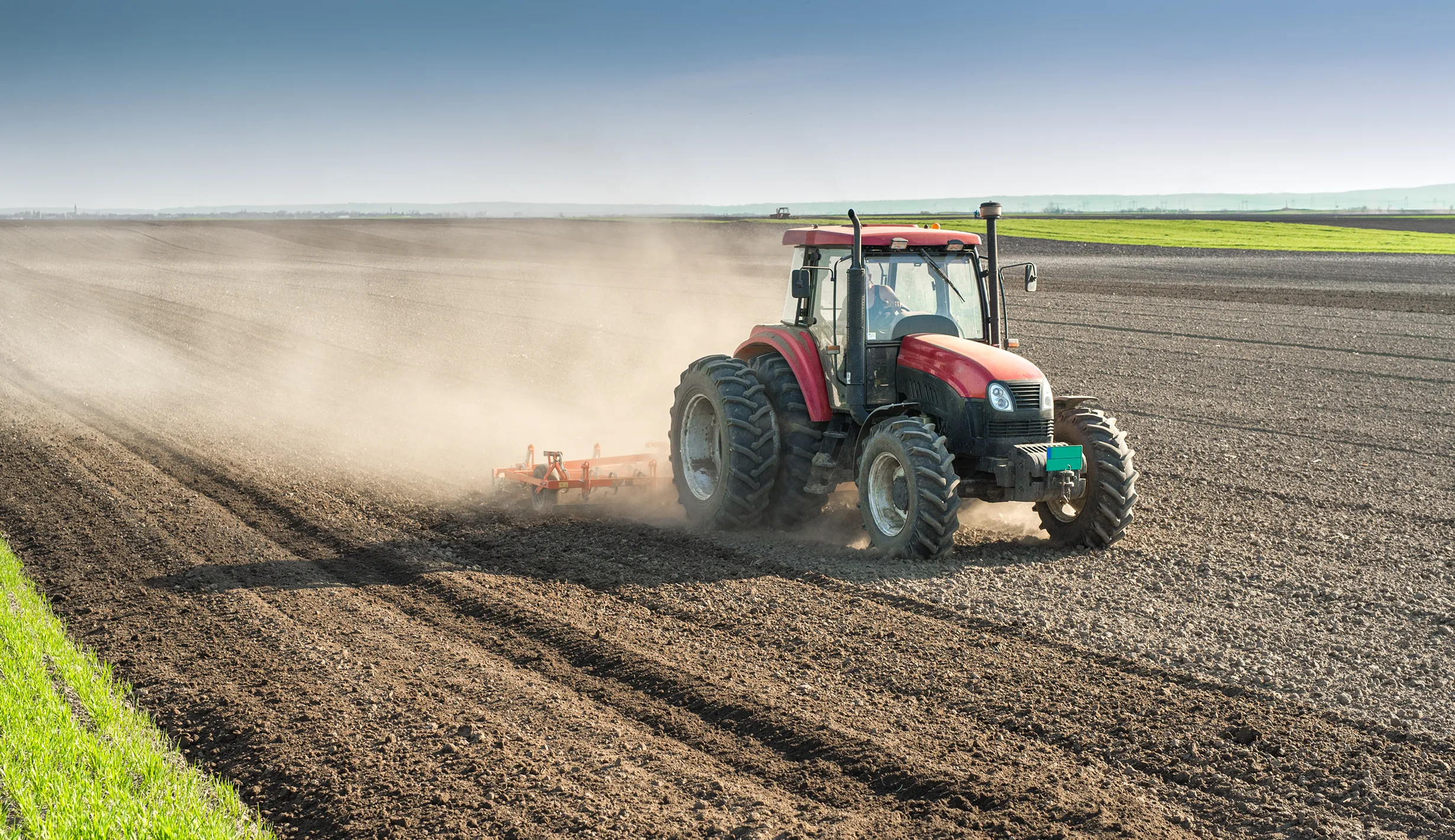 Farm buildings and open land representing farm insurance coverage