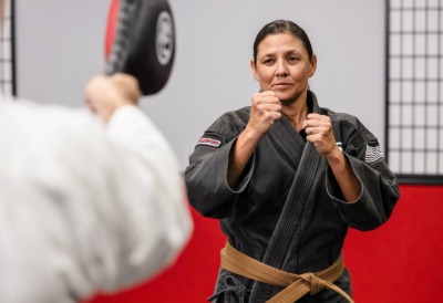 Adult Karate students training in the dojo.