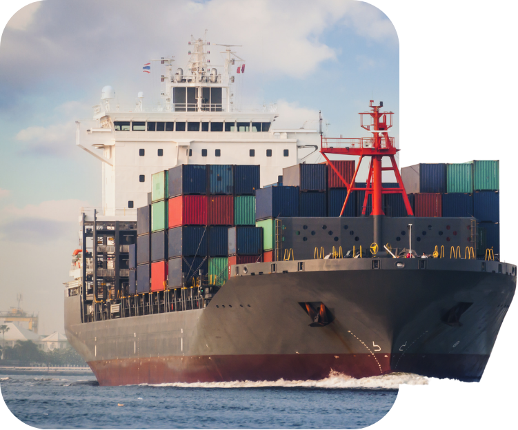 Large cargo ship loaded with colorful shipping containers moving on the water under a partly cloudy sky.