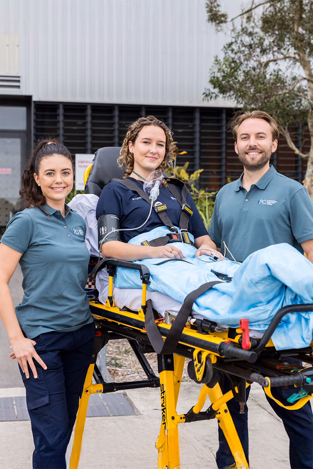 Paramedics standing in front of an ambulance
